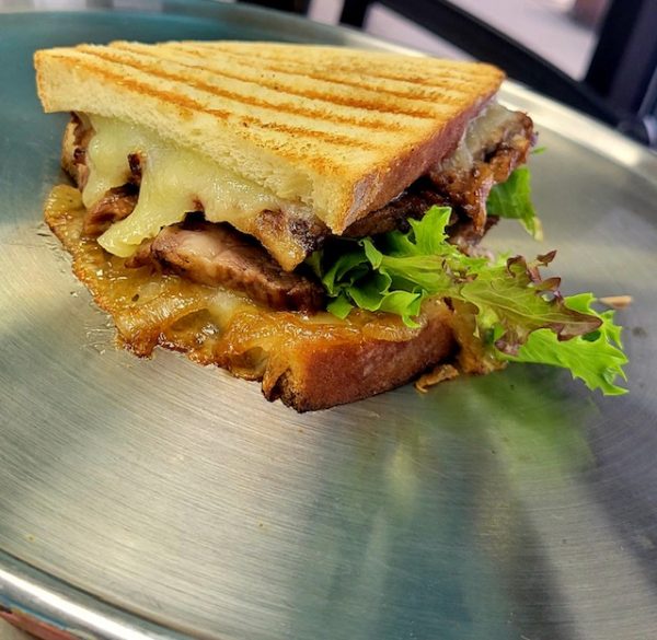 Brisket with Caramelized Onions and White Cheddar Panini